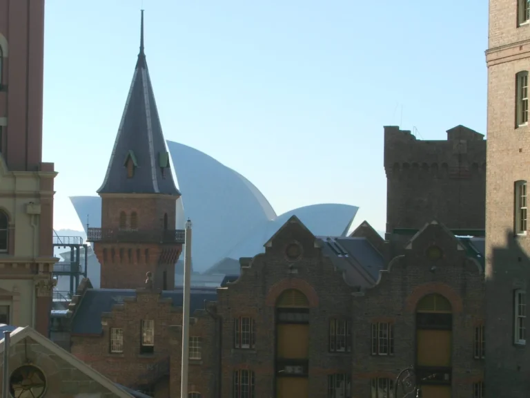 Historic Rocks buildings with church spire and Opera House visible in background.