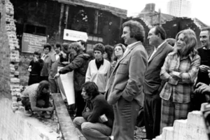Historic black-and-white photograph of 1970s Green Bans movement gathering in The Rocks precinct.