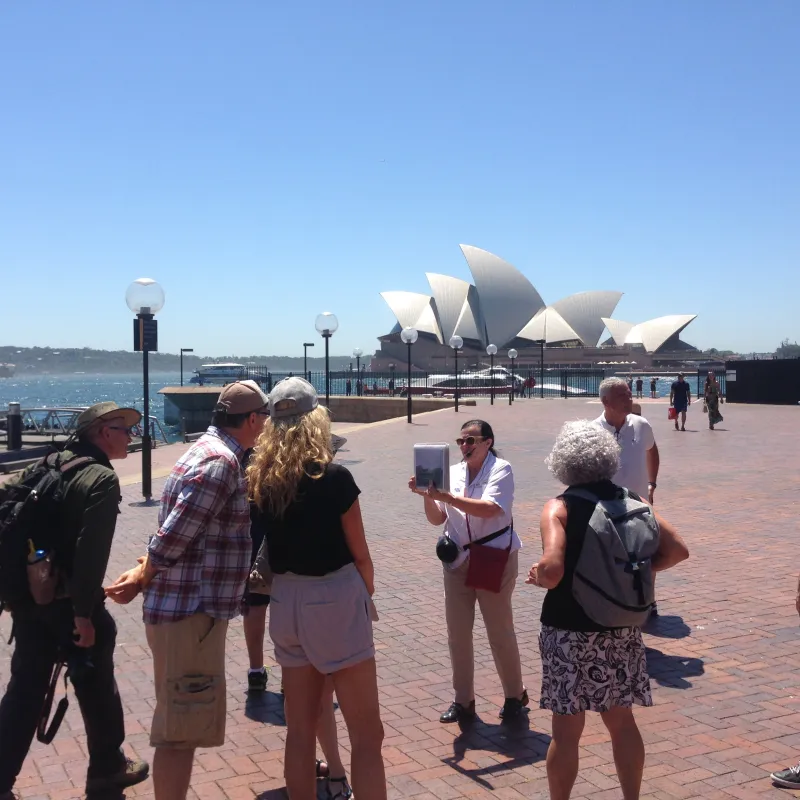 people standing in front of the opera