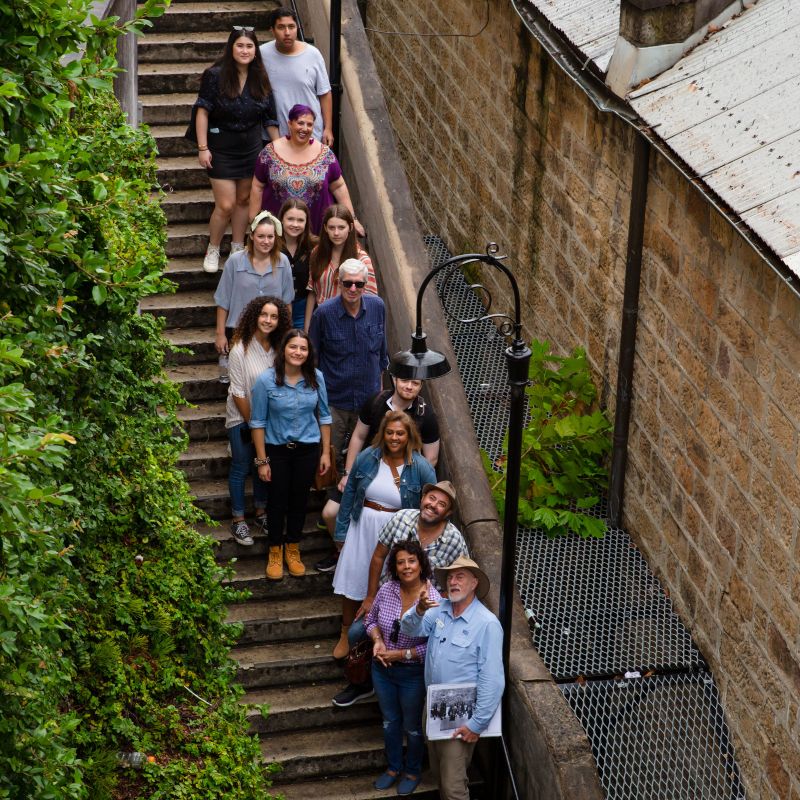 group of people standing on stairs