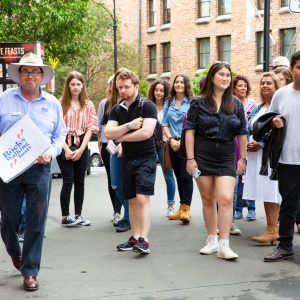 a group of people walking down the street