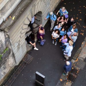 a group of people on a sidewalk