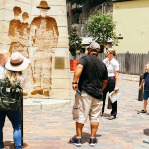 a group of people walking down a street